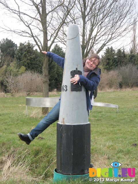 P1011273 Jenni by border marker between Belgium and the Netherlands